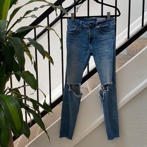 Ripped knee medium wash denim jeans
